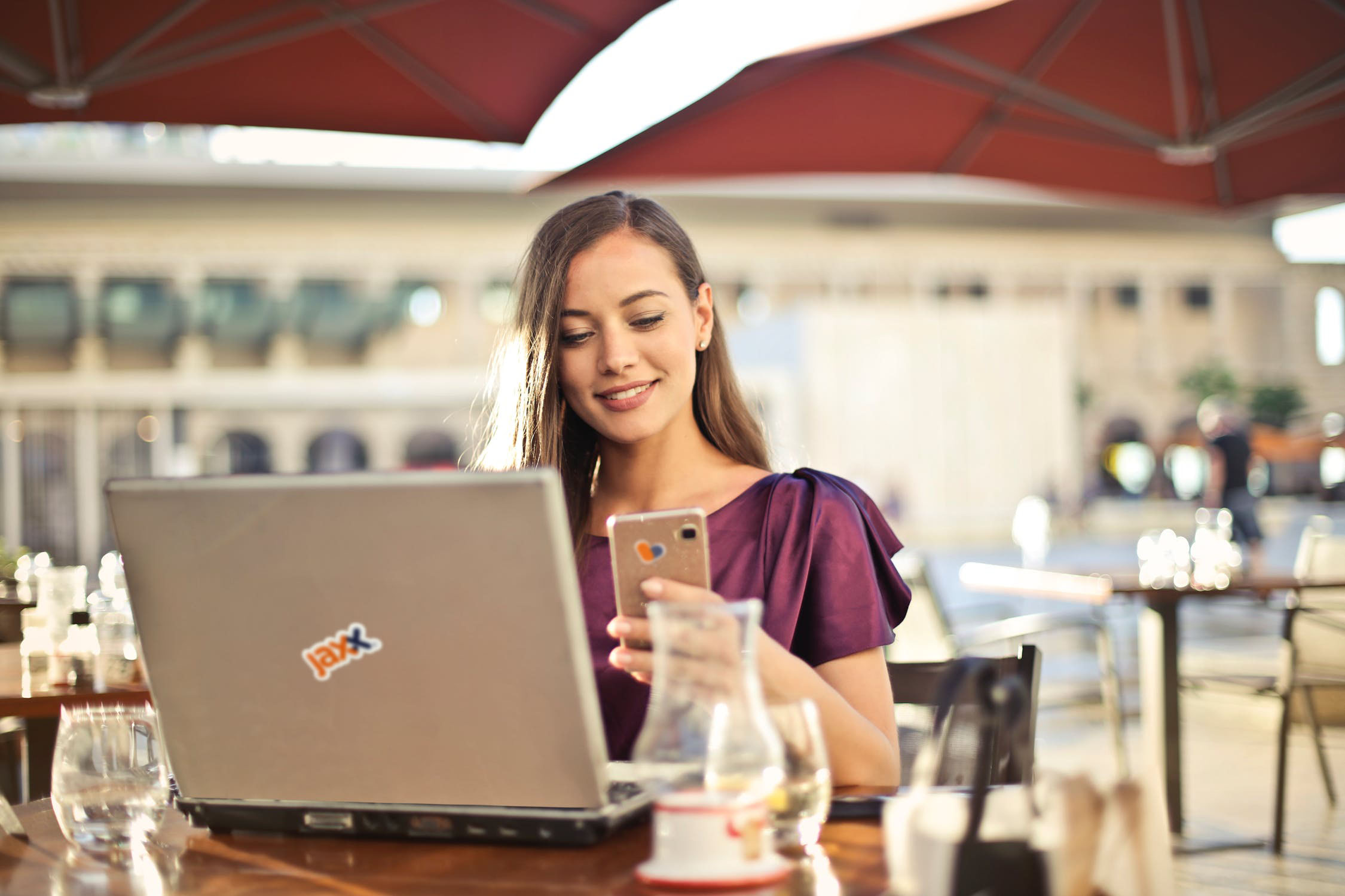 A Jaxx Liberty user reviewing their wallet on a laptop and phone